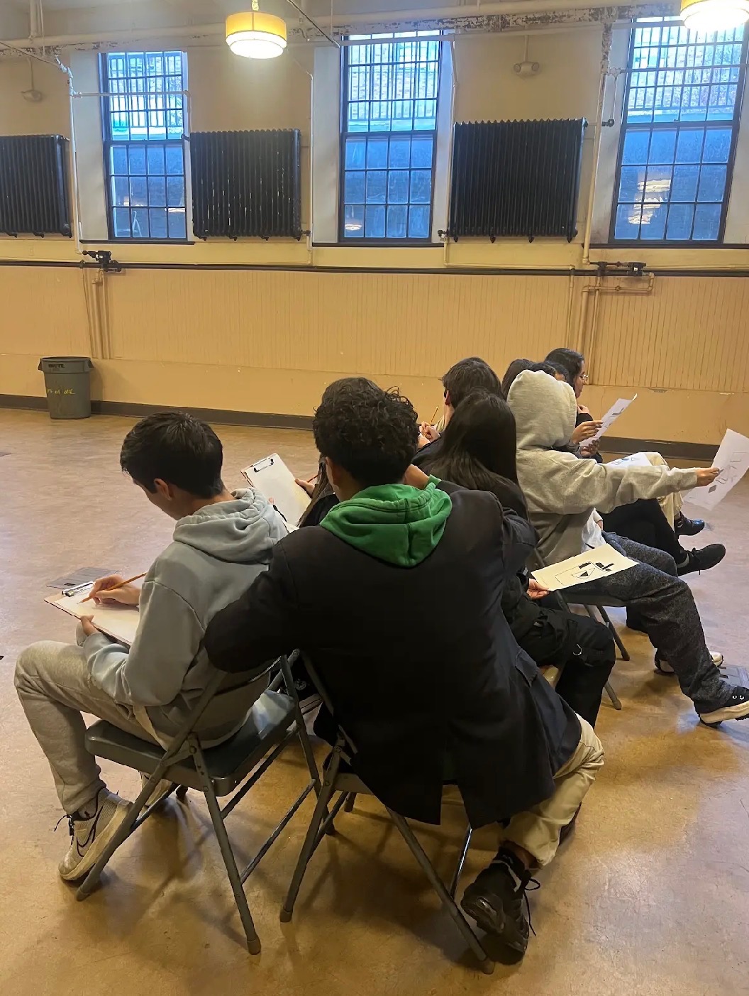 Students sketching during a workshop session